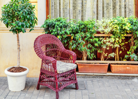 Wicker chair on the street near the cafe in Malaga city. Spain  Costa del Sol, Andalusia, Spainの写真素材