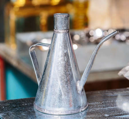 Close-up aluminum oil jar on the market in Jerusalem. Israel