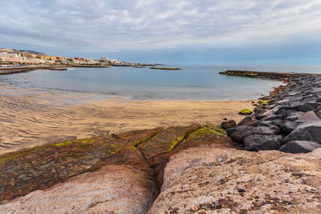 Rocks at topical beach at beautiful sunset. Costa Adeje, Tenerife, Spainの写真素材