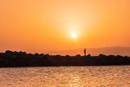 Silhouette of man at sea sunset background, Tenerife, Canary islands, Spain. Tenerife, Canary Islands, Spainの写真素材