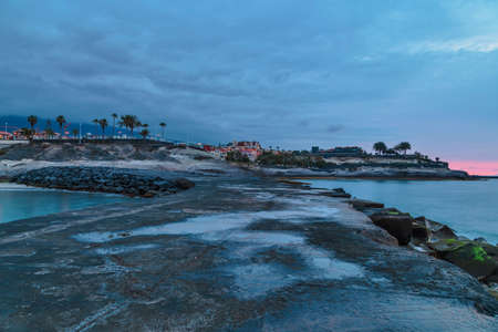 Tropical beach at beautiful sunset. Costa Adeje, Tenerife, Spainの写真素材