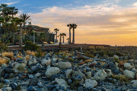 Volcanic stones beach in sunset time in Tenerife, Canary Islands, Spainの写真素材