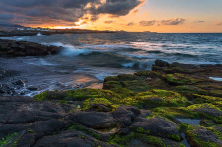 Sunset time at stones part of Playa de la Tejita, Tenerife, Spainの写真素材