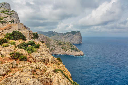 Landscape of rocky coast before a storm under gloomy dramatic sky (cape formentor). Mallorca. Balearic islands. Spainの写真素材