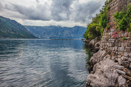 Gloomy view of Kotor bay under a dramatic overcast sky. Montenegroの写真素材