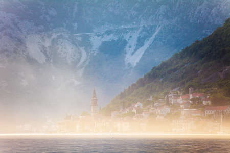 Early misty morning landscape with sea and mountain views. Kotor bay. Montenegro