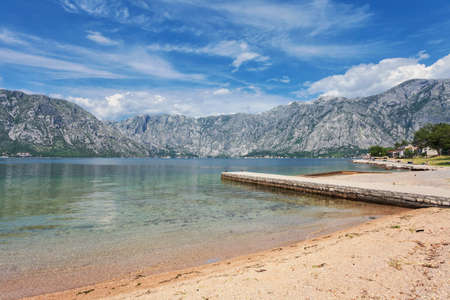 Morning small pebble beach. Kotor bay. Montenegro
