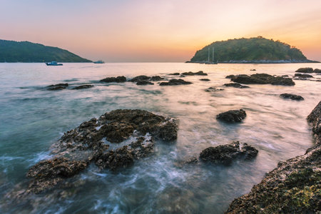 Beautiful sunset on the rock beach. Phuket, Thailandの写真素材