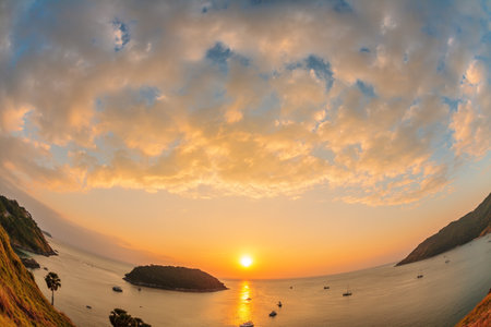 Panoramic view on sunset sea, small island, palms and boats in fish-eye lense. nature backgroundの写真素材