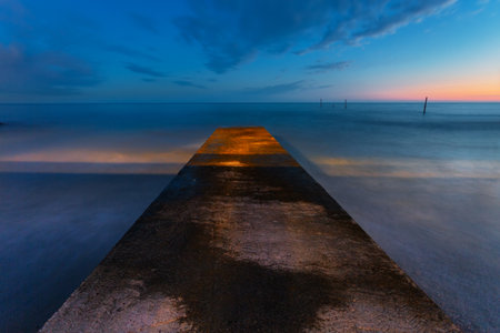 View of the pier at sunset time before night. Sochi. Russiaの写真素材