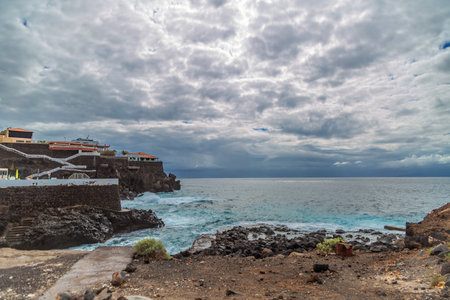 Rocky beach in cloudy gloomy weather. Tenerife island, Spainの写真素材