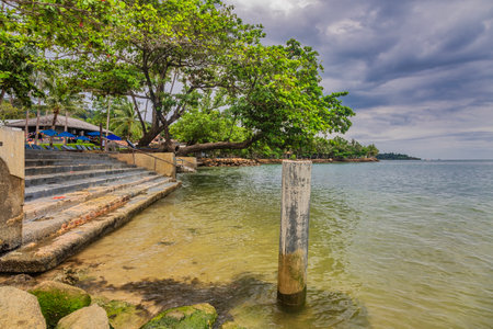 Wooden boardwalk at one of the hotels under a glowy dramatic sky on Kai Bae beach. Koh Chang island, Thailandの写真素材