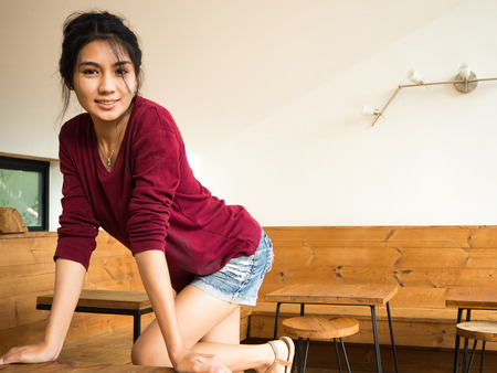 Asian woman sitting on the chairの写真素材