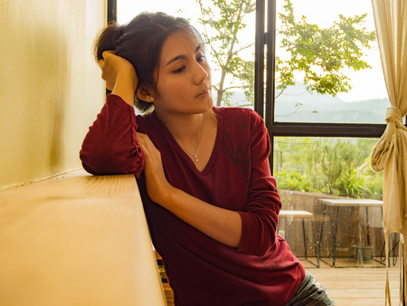 Asian woman sitting on the chairの写真素材