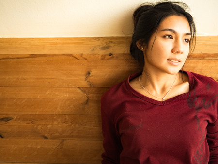 Asian woman sitting on the chairの写真素材