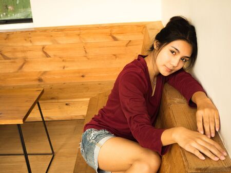 Asian woman sitting on the chairの写真素材