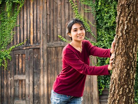 Asian woman standing on the wood plateの写真素材