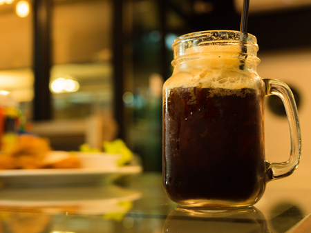 Black coffee in glass on the table