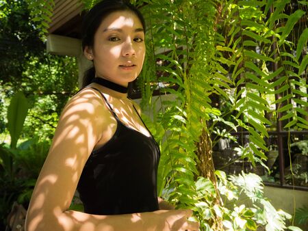 Asian woman in the garden, concept save the worldの写真素材