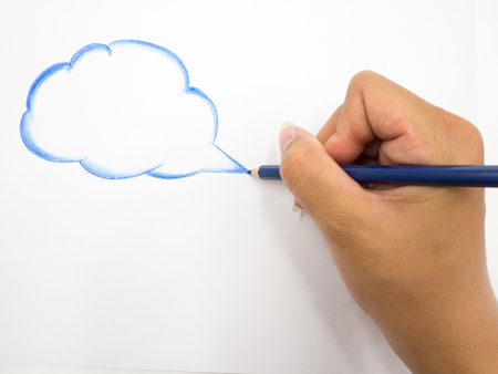 Human's hand holding pencil on white backgroundの写真素材