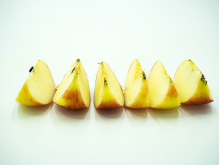 Slice of red apple on white backgroundの写真素材