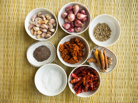 Curry Raw Matiral in the white cup on the brown matの写真素材