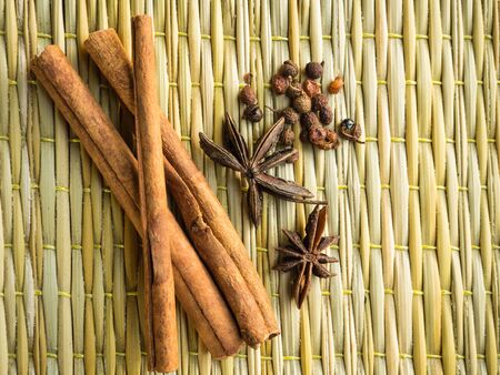 Cinnamon on the brown matの写真素材