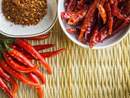 Chili on the brown matの写真素材
