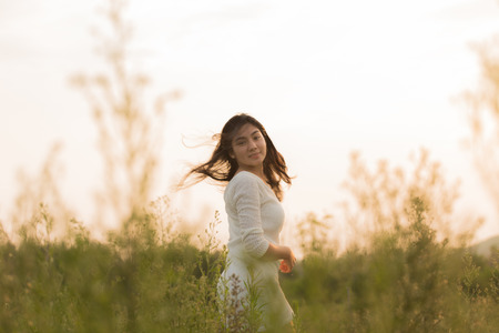 Outdoor portrait asian girl in the flowers gardenの写真素材
