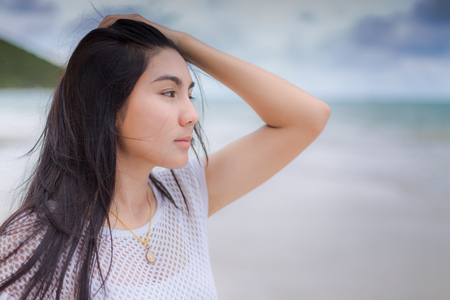 Beautiful Asian woman vacation on beach of Thailand.の写真素材