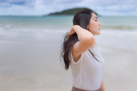 Beautiful Asian woman vacation on beach of Thailand.の写真素材