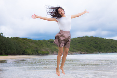 Beautiful Asian woman vacation on beach of Thailand.の写真素材