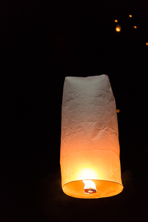 Floating sky lanterns during Loy Kratong Festival in Nan, Thailand.の写真素材
