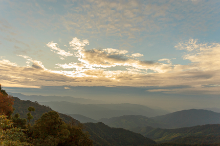 Beautiful cloudy weather over mountains, cloudy and fog in the moring with sunriseの写真素材