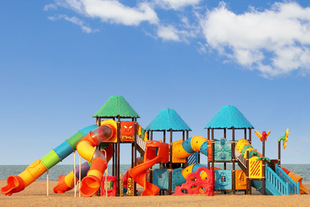 Children's playground on the sandy beachの写真素材
