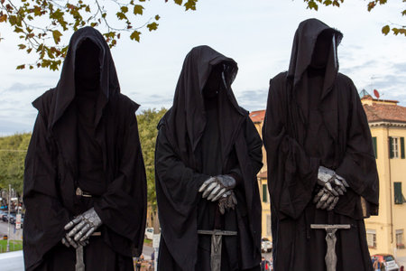 Three cosplay figures dressed as death