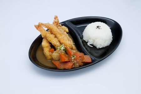 Tempura Moriawase with rice in black plateの写真素材