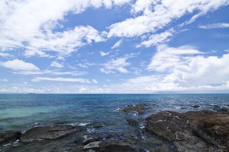 Tropical Beach with big stones in waterの写真素材