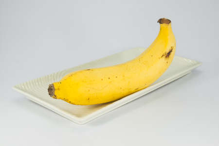 banana on the white plate の写真素材