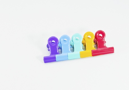 An image of colorful paper clips on white の写真素材