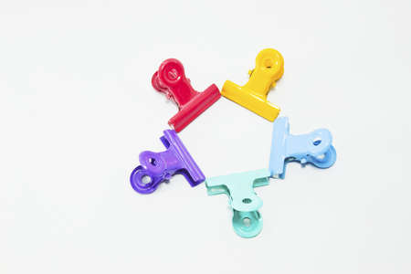 An image of colorful paper clips on white の写真素材