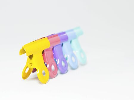 An image of colorful paper clips on white の写真素材