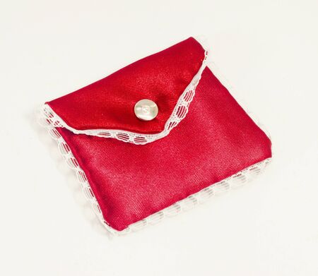 Beautiful Red Silk Pouch to hold Jewelry and Delicate items isolated on White Background の写真素材