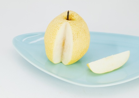 yellow pears isolated on plateの写真素材
