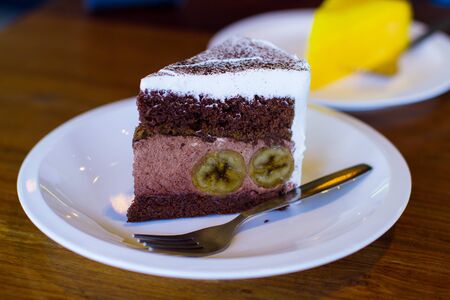Slice of banana chocolate cake