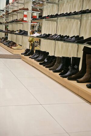 Samples of footwear on shelfs in shopの写真素材