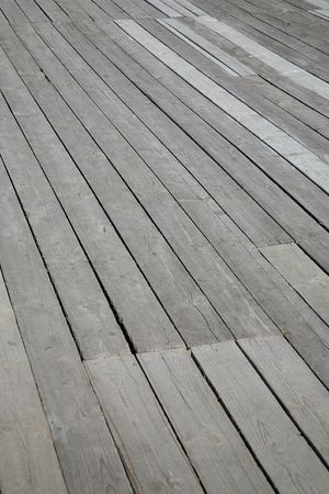 Old floor in the street from wooden boardsの写真素材