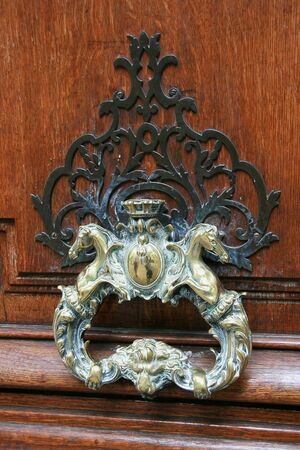 The old metal handle of a door