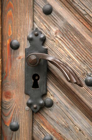 The old metal handle of a door の写真素材