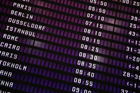 The schedule of flights on an electronic board of the airportのeditorial素材